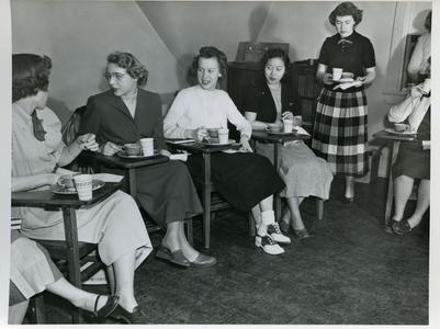Young Women's Christian Association members eating lunch