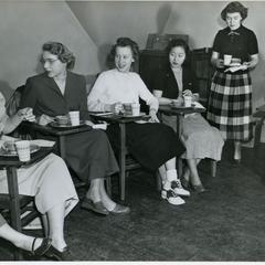 Young Women's Christian Association members eating lunch