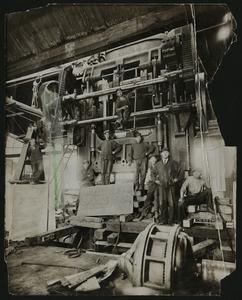 Nash factory employees in front of a Bliss Press