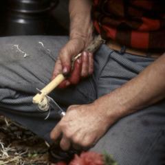 Duncan Williamson whittling a wooden flower