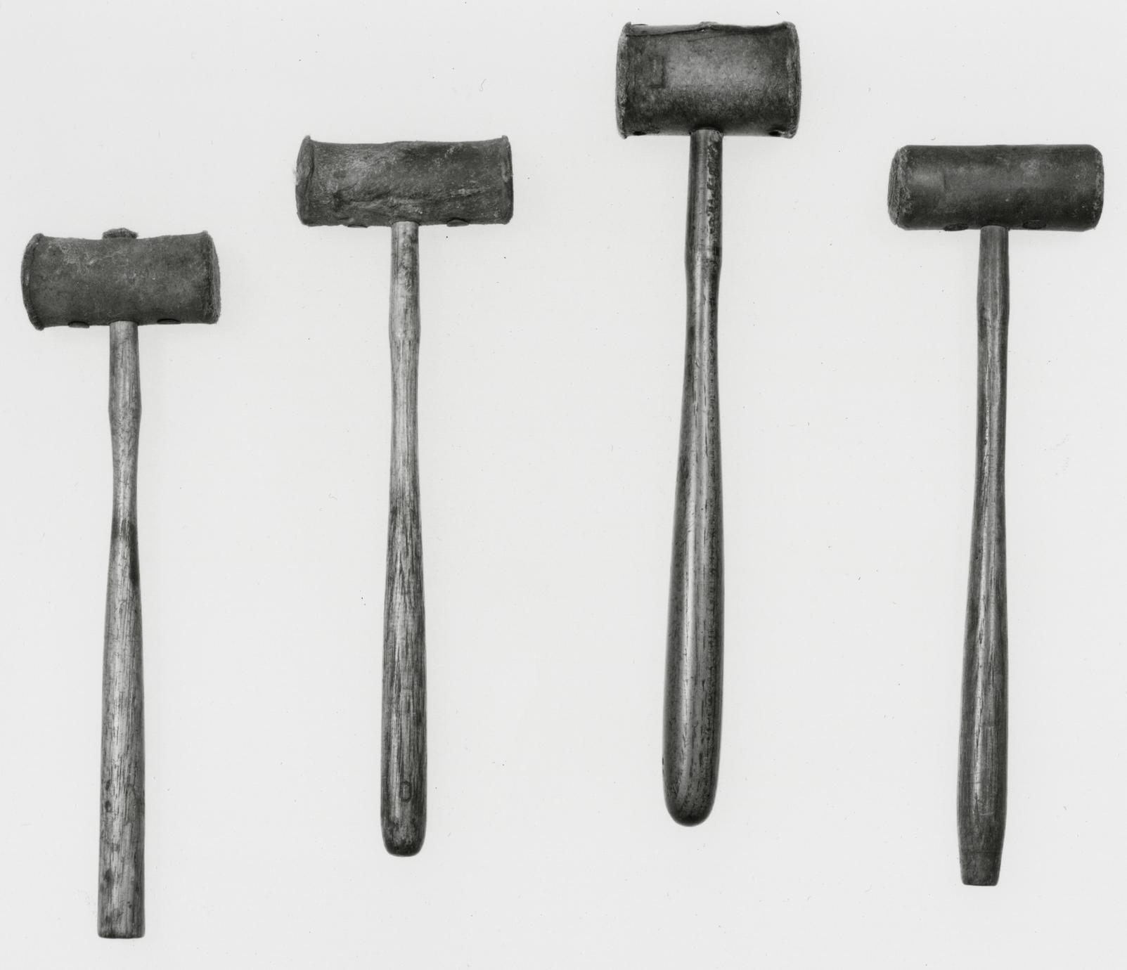 Black and white photograph of clockmaker's mallets.