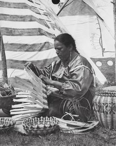 Native American woman weaving