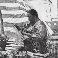 Native American woman weaving