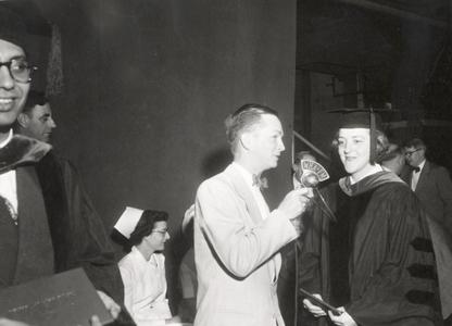 Ann Fred receiving medical degree