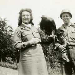 Ray Cunneen standing next to a falconer
