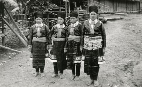Four Blue Hmong (Hmong Njua) women pose in a Hmong village in the vicinity of Muang Vang Vieng in Vientiane Province