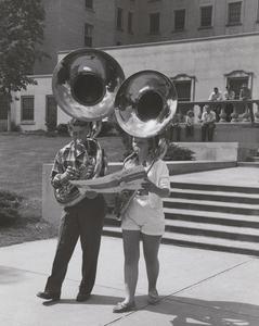 Two students playing the sousaphone at a music clinic