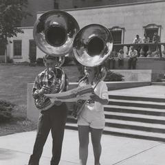 Two students playing the sousaphone at a music clinic