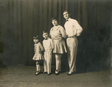 Harry Metscher family standing on stage