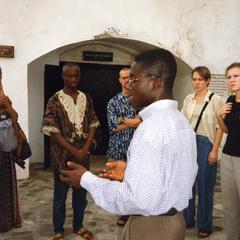 Tour guide addressing group at Cape Coast Castle