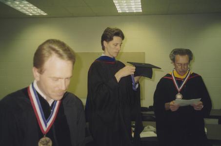 Three staff members at Commencement
