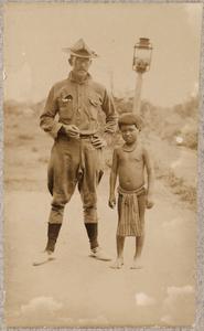 American soldier with Filipino child