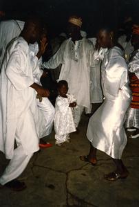 People dancing with a child