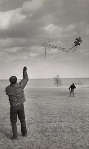 Kite flying on campus lawn, Manitowoc, March 1969