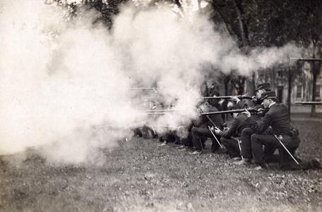 Cadets firing rifles in sham battle