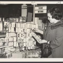 A woman shops for sewing supplies at a drugstore
