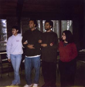 Participants linking arms at 2001 Student of Color Leadership Retreat.
