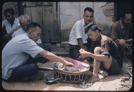 Men making wax flowers