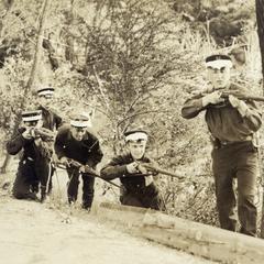 Cadets with rifles in the woods
