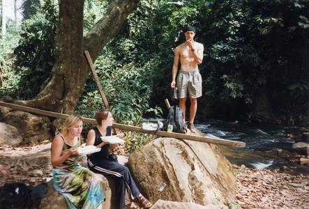 Group rest under tree in Kintampo Falls