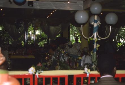 Plants, guests, and decorations at Apara wedding