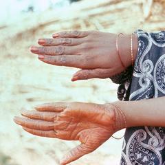 Woman's Hands Decorated with Henna
