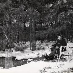 Karl Paul Link reads a book outdoors