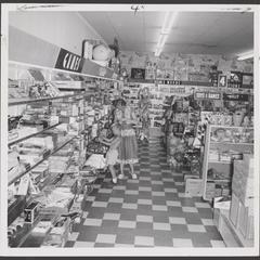 A woman and her son examine toys in the toy department