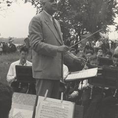 Clarence Dykstra conducts