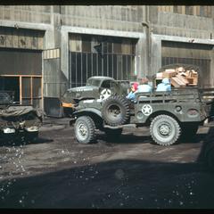 Red Cross vehicles in front of a building