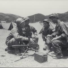 Three PEKEK Soldiers receiving military instructions, Manila, 1945