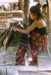 A Kalom woman weaves a new skirt in Houa Khong Province