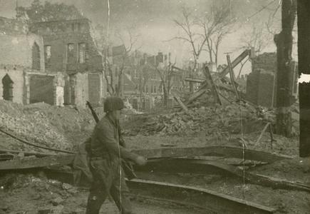 Marching through bombed-out Magdeburg after battle