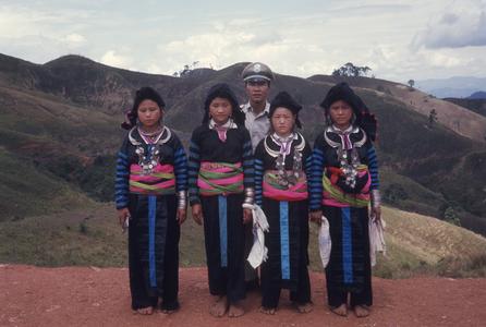 Ethnic Hmong girls with police officer