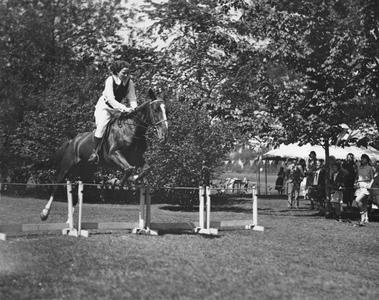 Woman equestrian jump