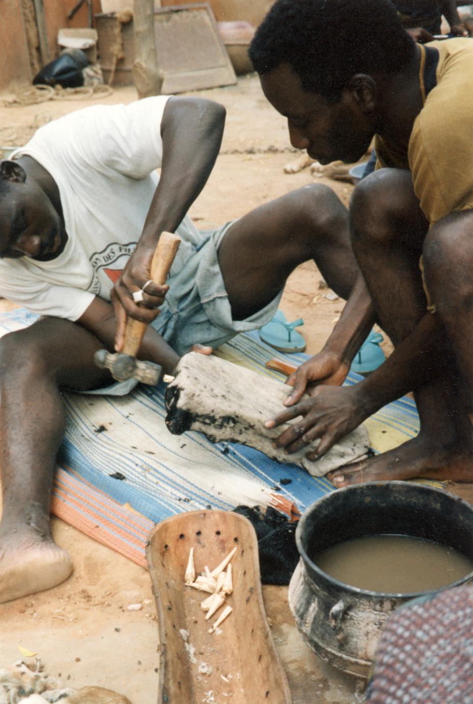Pegging the Goat Skin on the Wooden Body of the Ngoni