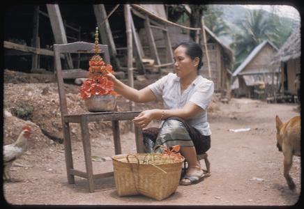 Woman arranging flowers