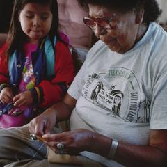 Margaret Hart stitches a moccasin