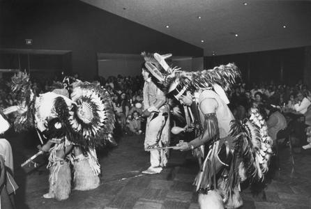 Native American dancers in traditional costumes