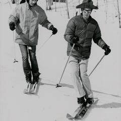 Students skiing down a hill