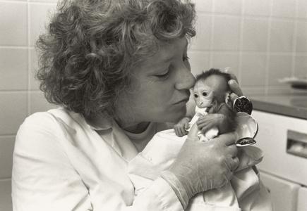 Mary Schneider with rhesus monkey