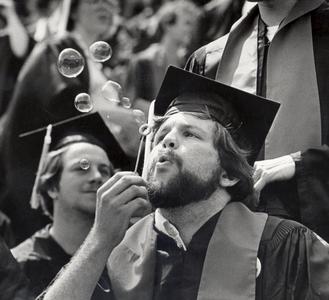 Blowing bubbles at Commencement