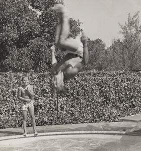 Elroy Hirsch jumping into a pool