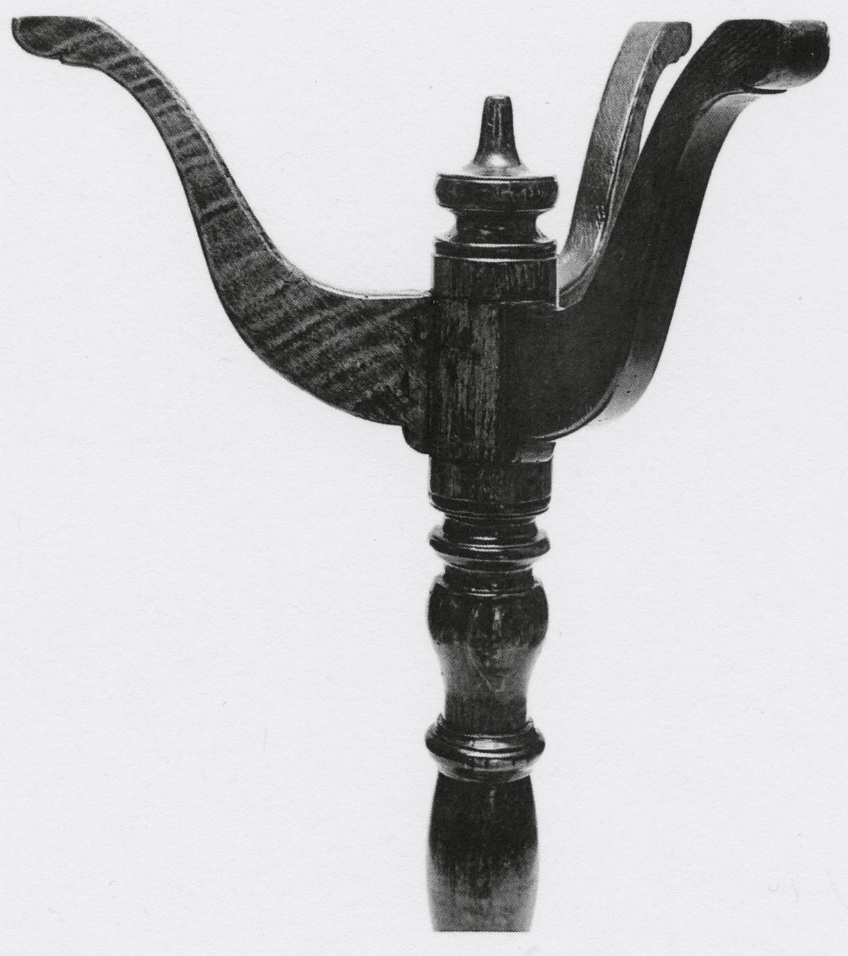Black and white photograph of a stand's legs.