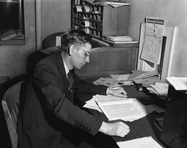 Edwin Young at his desk
