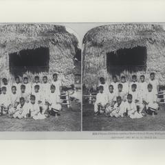 Filipino children outside a native school house, ca. 1901