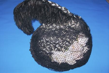 Woven black and white raffia hat