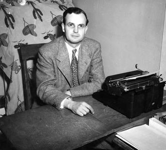 Harry Harlow at desk with typewriter