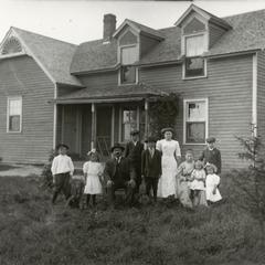 Family in front of house