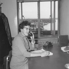 Lydia MacKenzie seated at desk